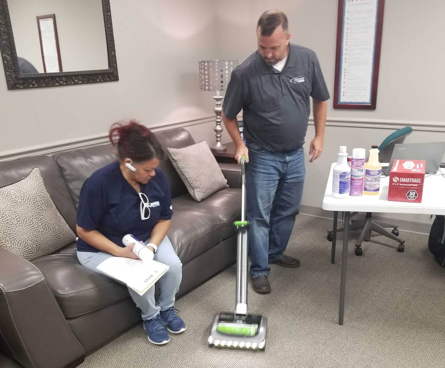 Corvus Franchisee learning carpet cleaning techniques from a Corvus employee