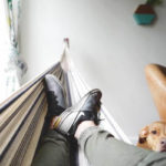 Manage stress at home: man in hammock