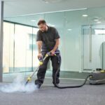 man performing carpet extraction for floor care