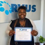 Franchise Owner Hayana Hill with welcome certificate