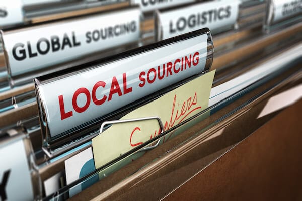 files in file cabinet with text reading "LOCAL SOURCING" and "Suppliers"