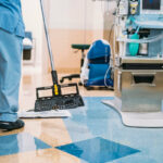 Janitor providing cleaning services in a doctor's office with a mop