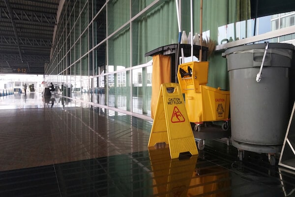 Image of yellow wet floor warning sign for cleaning safety guide