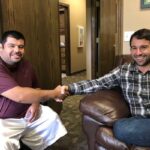 Corvus of Northwest Arkansas Franchisee Erick DePaz and Aaron Cambou shake hands