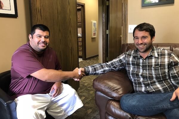 Corvus of Northwest Arkansas Franchisee Erick DePaz and Aaron Cambou shake hands