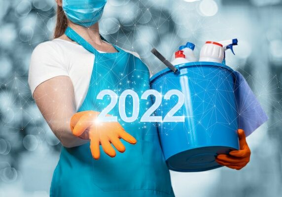 Cleaning lady holding supplies for spring cleaning 2022
